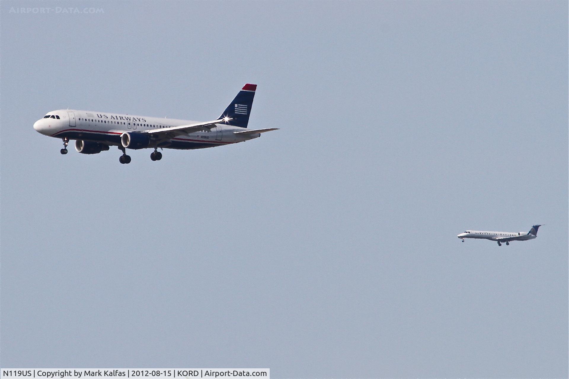 N119US, 2000 Airbus A320-214 C/N 1268, US Airways Airbus A320-214, AWE799 arriving from KPHL on RWY 27L with Chautauqua/United Express CHQ5010 (in the background) arriving from KMLI on 27R at O'Hare.