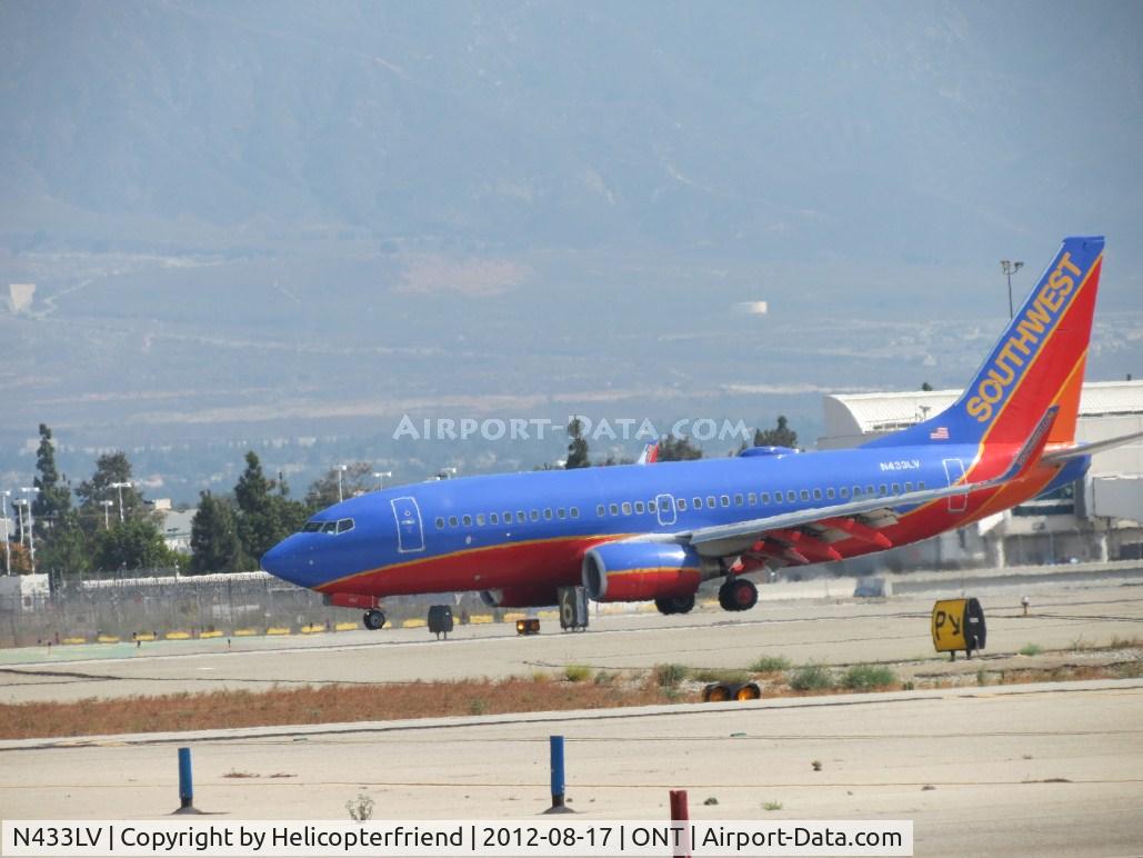N433LV, 2003 Boeing 737-7H4 C/N 33716, Just landed on 26R and preparing to taxi onto taxiway Papa to head back to terminal