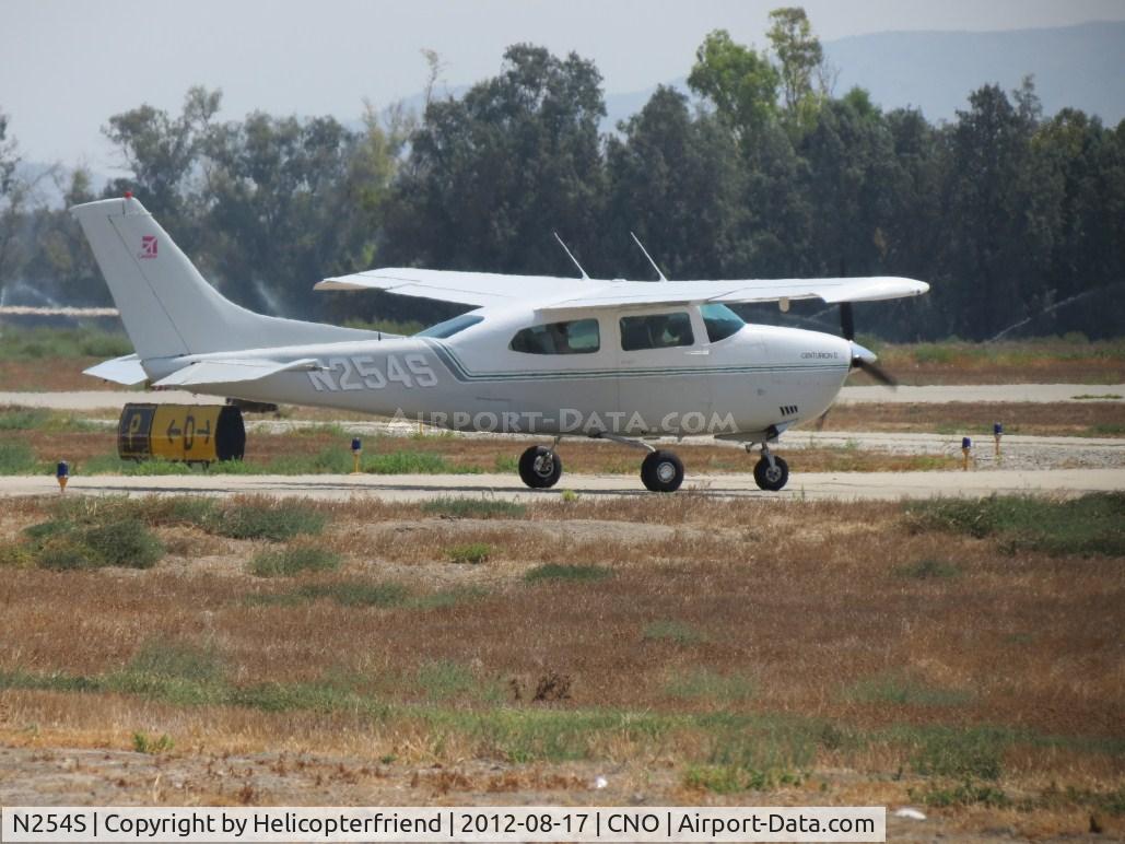 N254S, 1976 Cessna 210L Centurion C/N 21061198, Warming up/preflight on taxiway Papa stopped at taxiway Delta