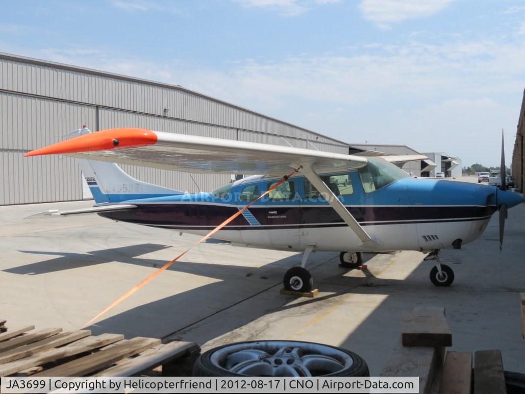 JA3699, 1974 Cessna TU206F Turbo Stationair Turbo Stationair C/N U20602295, Tied down and parked outside a hanger