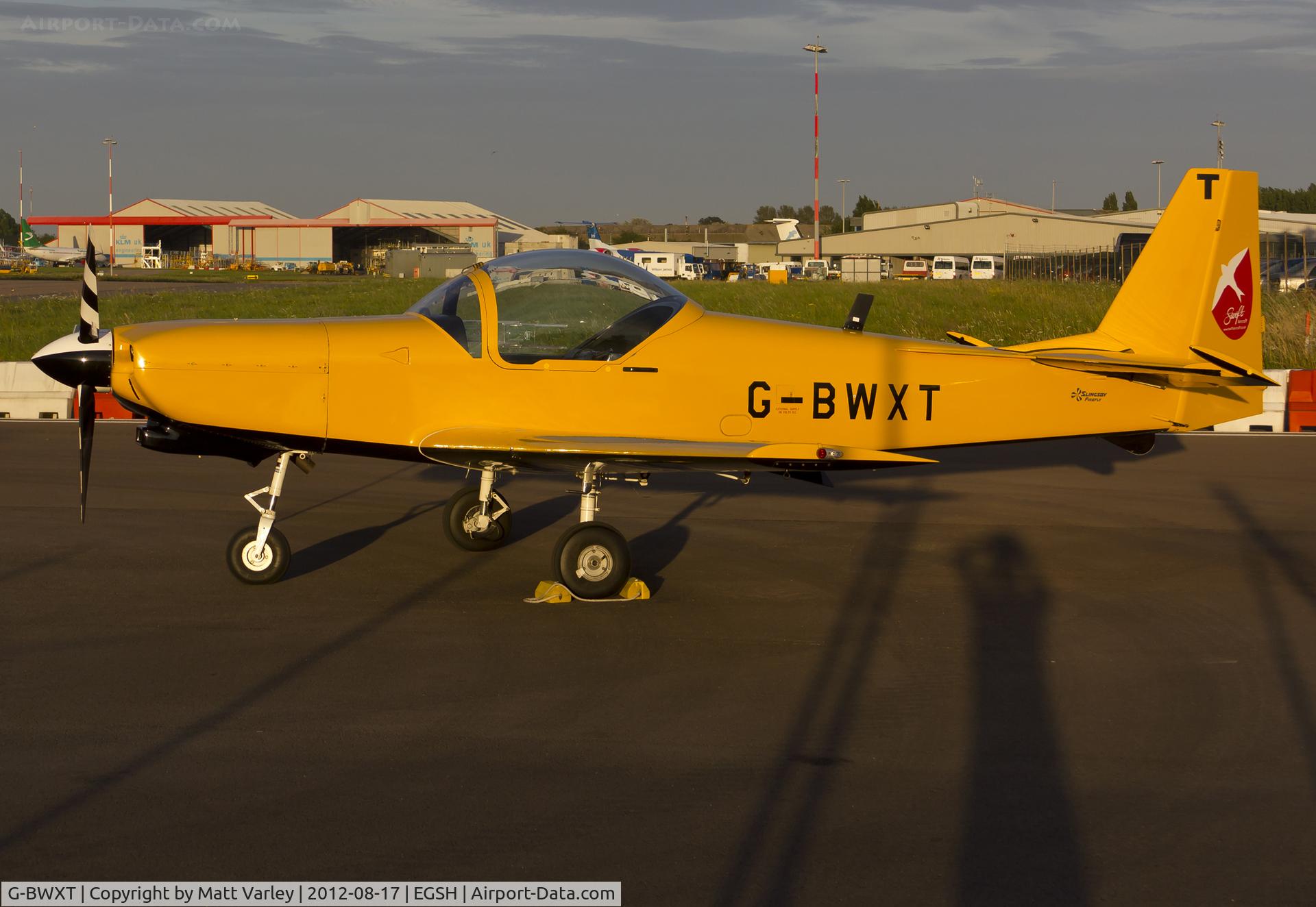 G-BWXT, 1997 Slingsby T-67M-260 Firefly C/N 2254, Sat on stand at SaxonAir in the setting sun.