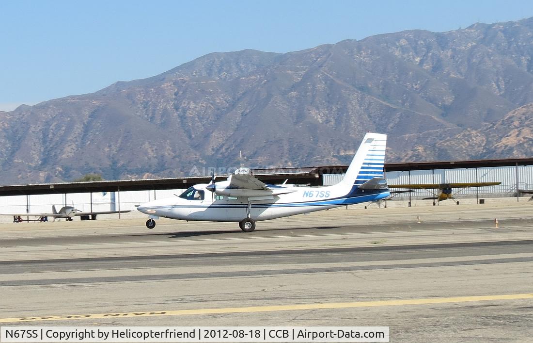 N67SS, 1967 Aero Commander 500-U C/N 1727-30, Main gear down, nose wheel coming down on runway 24