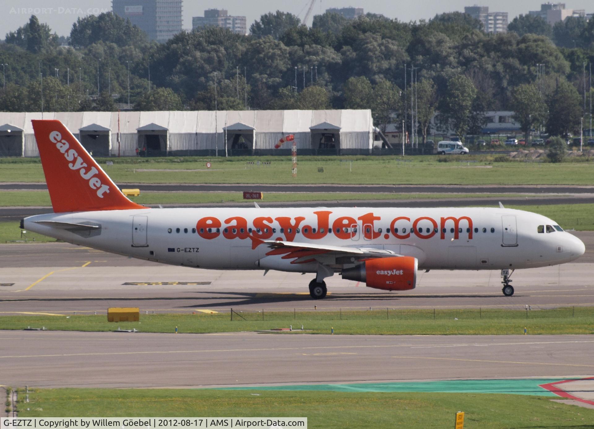 G-EZTZ, 2010 Airbus A320-214 C/N 4556, Taxi to runway 24 of Schiphol Airport for take off.