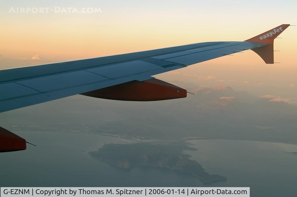G-EZNM, 2005 Airbus A319-111 C/N 2402, G-EZNM passing Cap Formentor on our flight from DTM ( EDLW ) to PMI ( LEPA ) in the first rays of morning light.