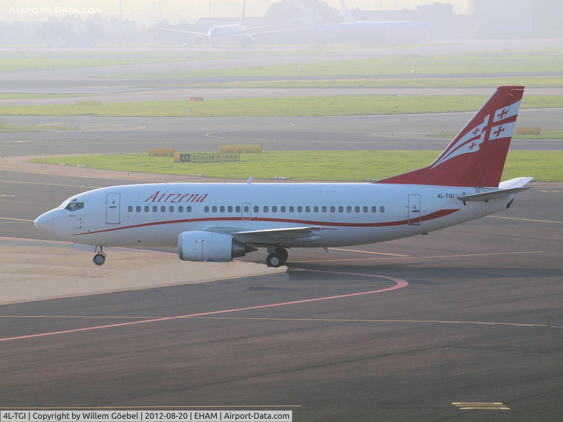 4L-TGI, 1996 Boeing 737-505 C/N 26336, Taxi to runway 24 of Schiphol Airport for take off.