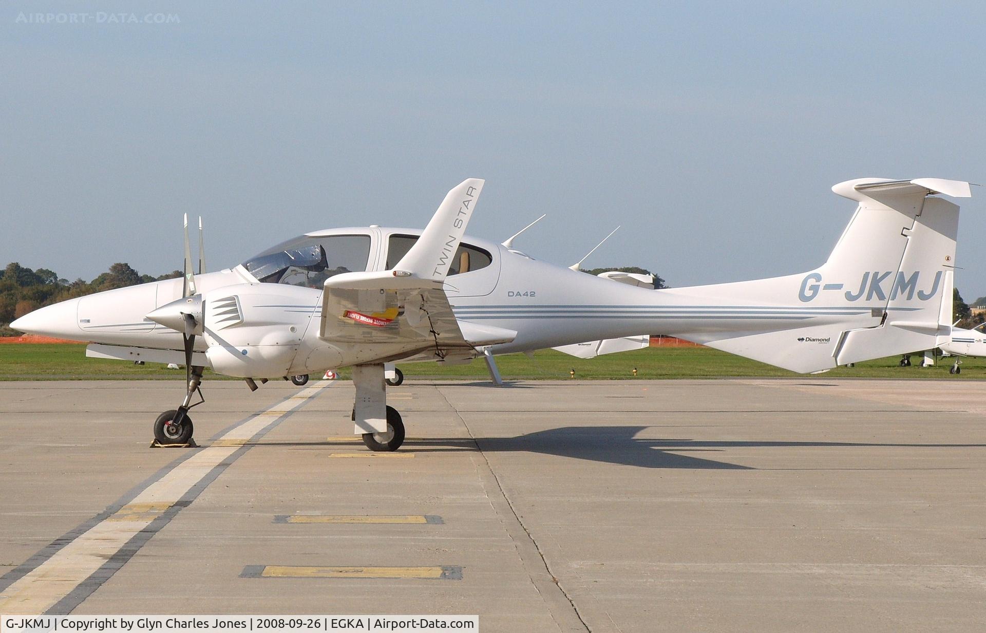 G-JKMJ, 2006 Diamond DA-42 Twin Star C/N 42.141, Enjoying the sunshine at Shoreham. Owned by Fteron Ltd.