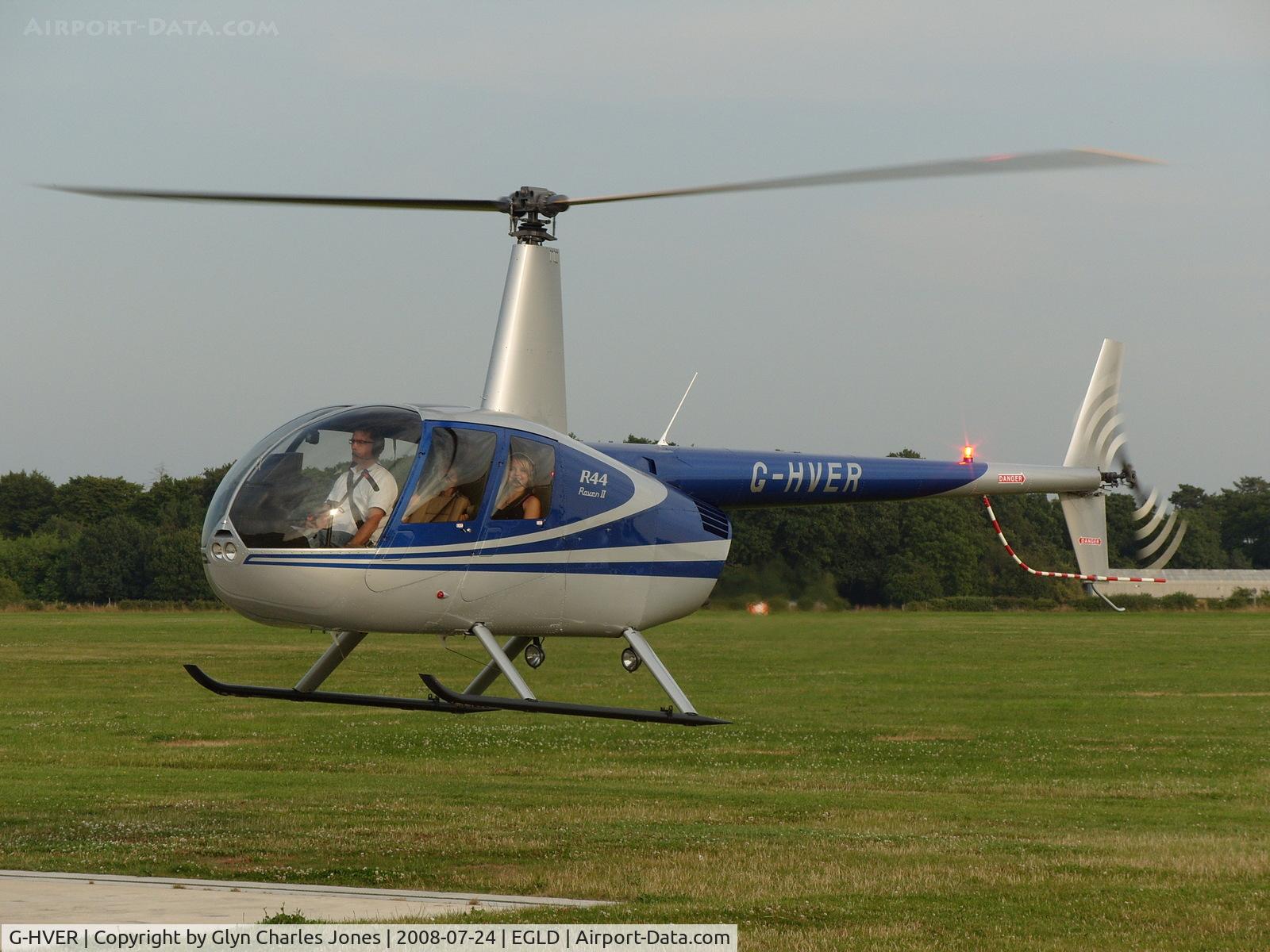 G-HVER, 2007 Robinson R44 Raven II C/N 11754, Just landing. Two very happy passengers after this pleasure flight! Owned by Equation Associates Ltd.