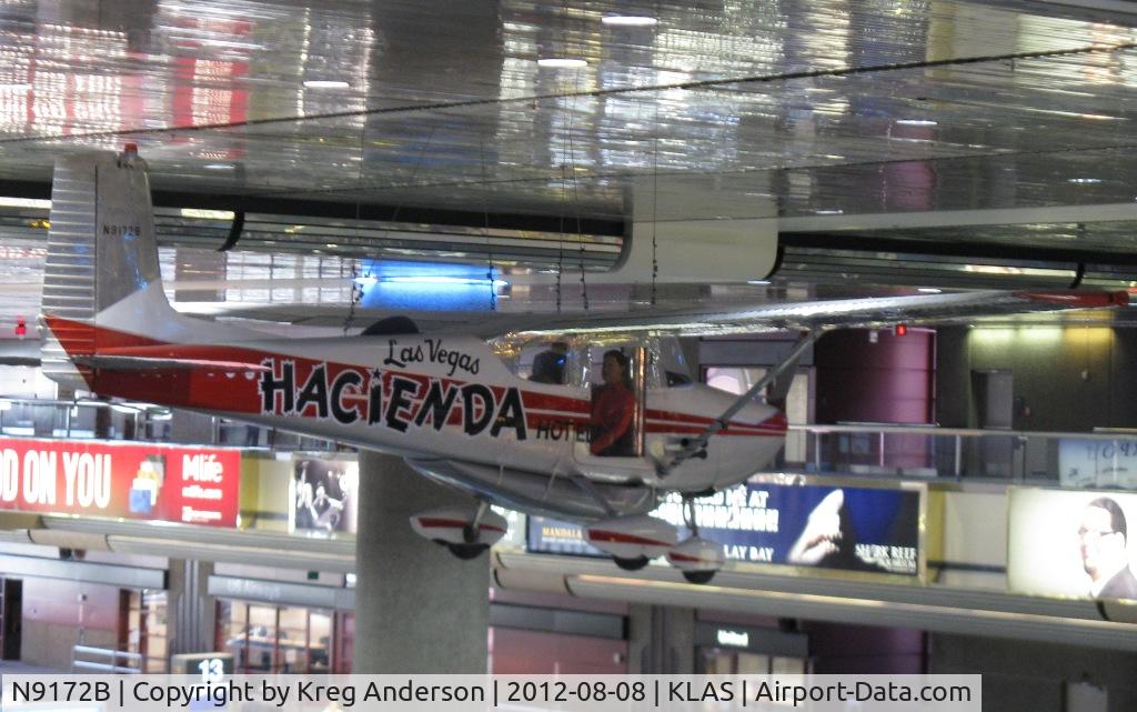 N9172B, 1958 Cessna 172 C/N 36772, Hacienda Hotel Cessna 172 Skyhawk hanging over the baggage claim at KLAS.
