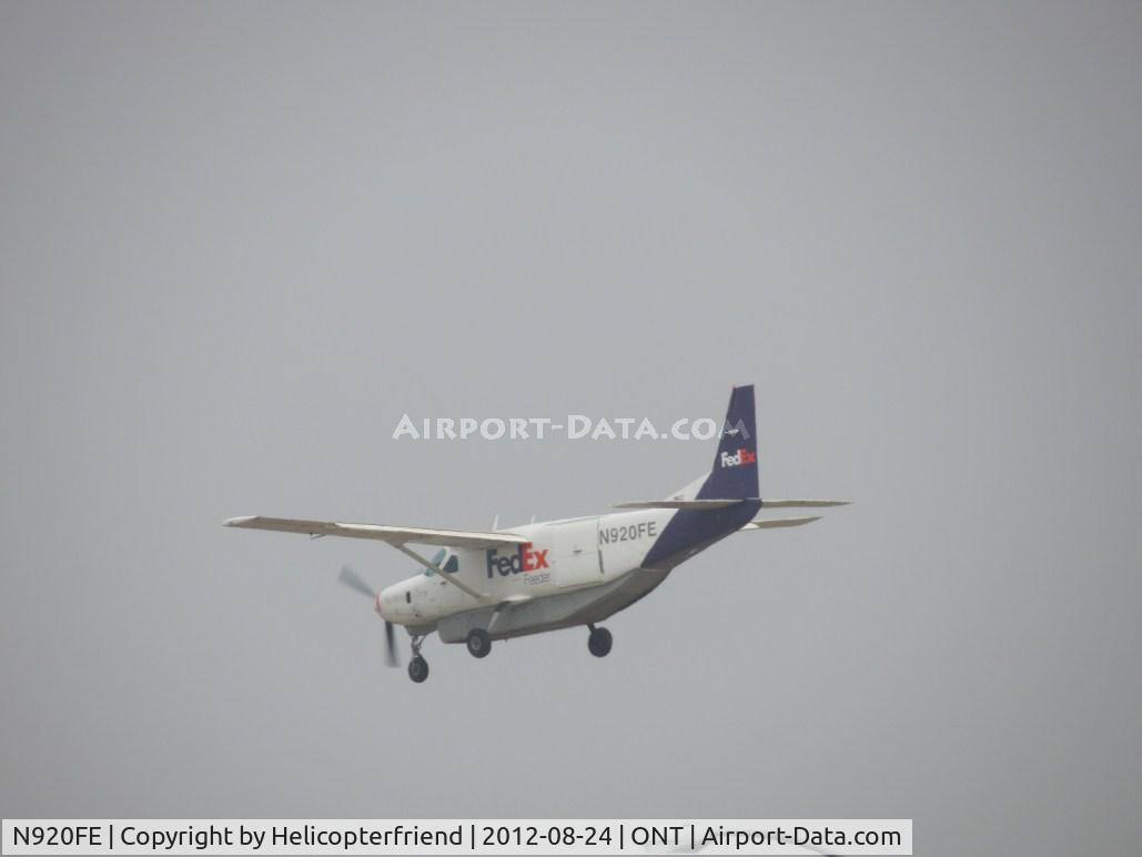 N920FE, Cessna 208B C/N 208B0020, On final over the outer fence