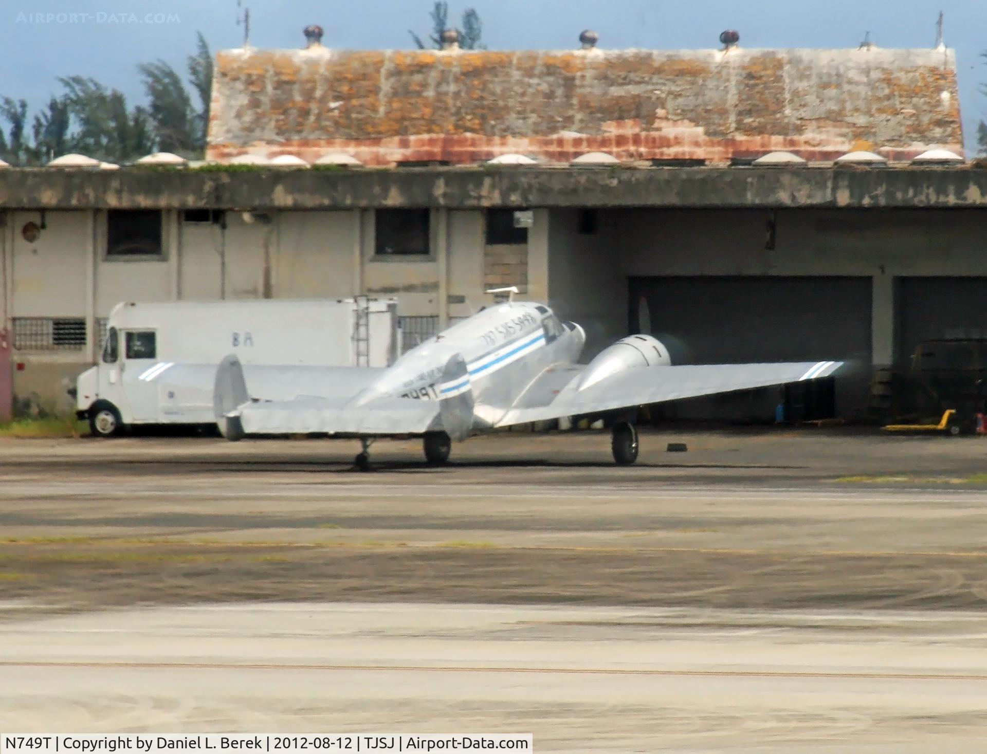 N749T, 1955 Beech E18S C/N BA-55, An elderly twin Beech soldiers on for Seven Stars Air Cargo at San Juan, PR.
