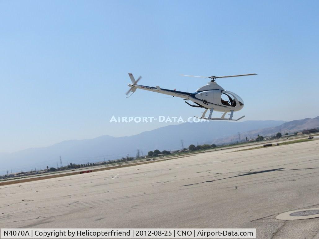 N4070A, 2004 Rotorway Exec 162F C/N 6345DS, Lifting off westbound