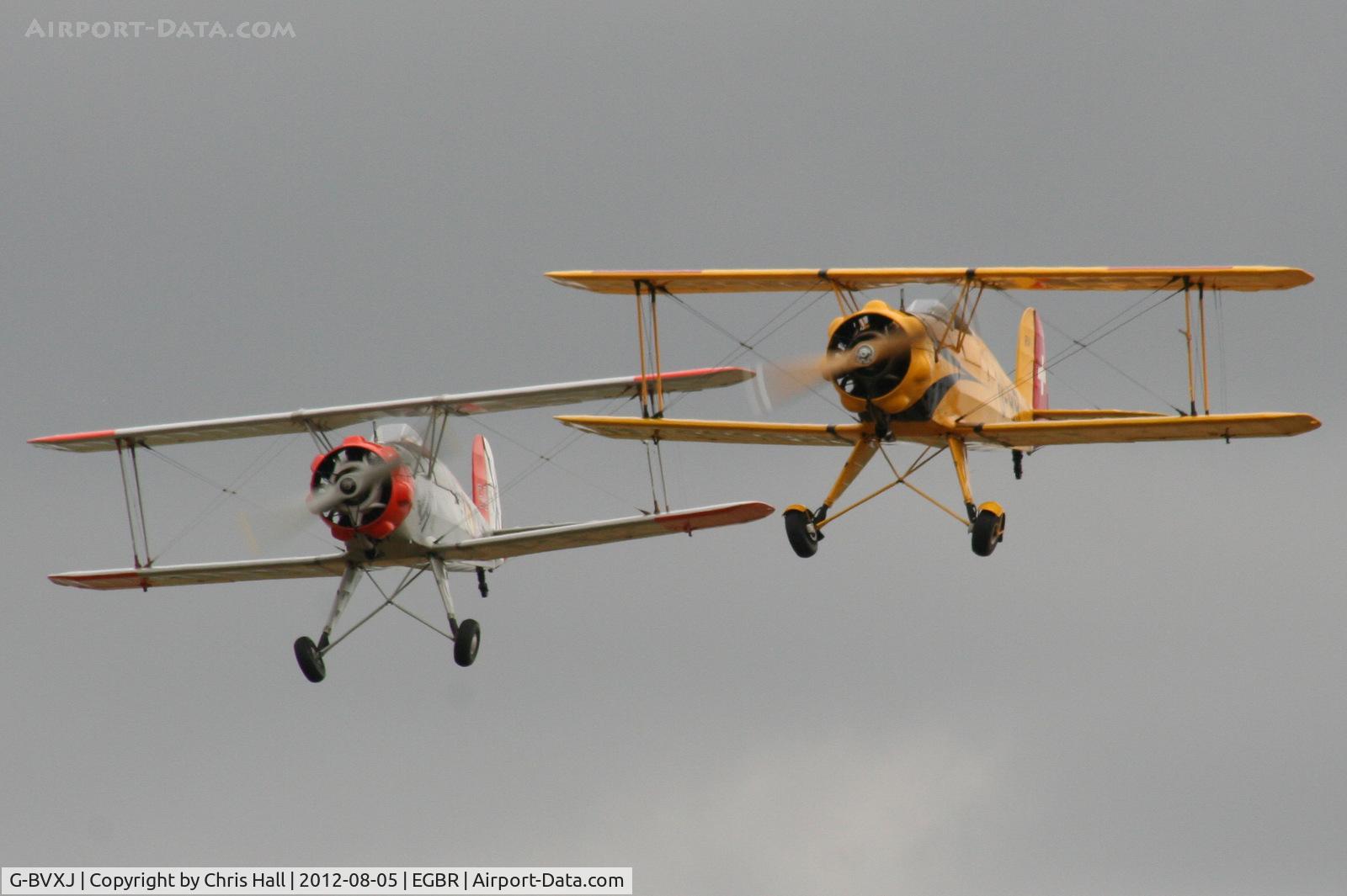 G-BVXJ, 1937 Bucker Bu-133C Jungmeister C/N E-19, with G-AXMT at The Real Aeroplane Club's Summer Madness Fly-In, Breighton
