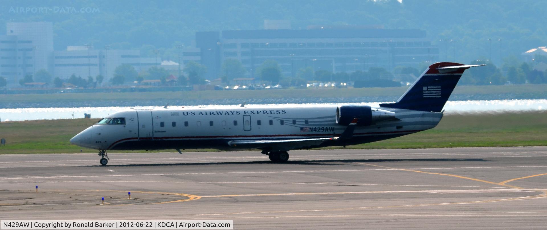 N429AW, 2002 Bombardier CRJ-200LR (CL-600-2B19) C/N 7711, Takeoff DCA