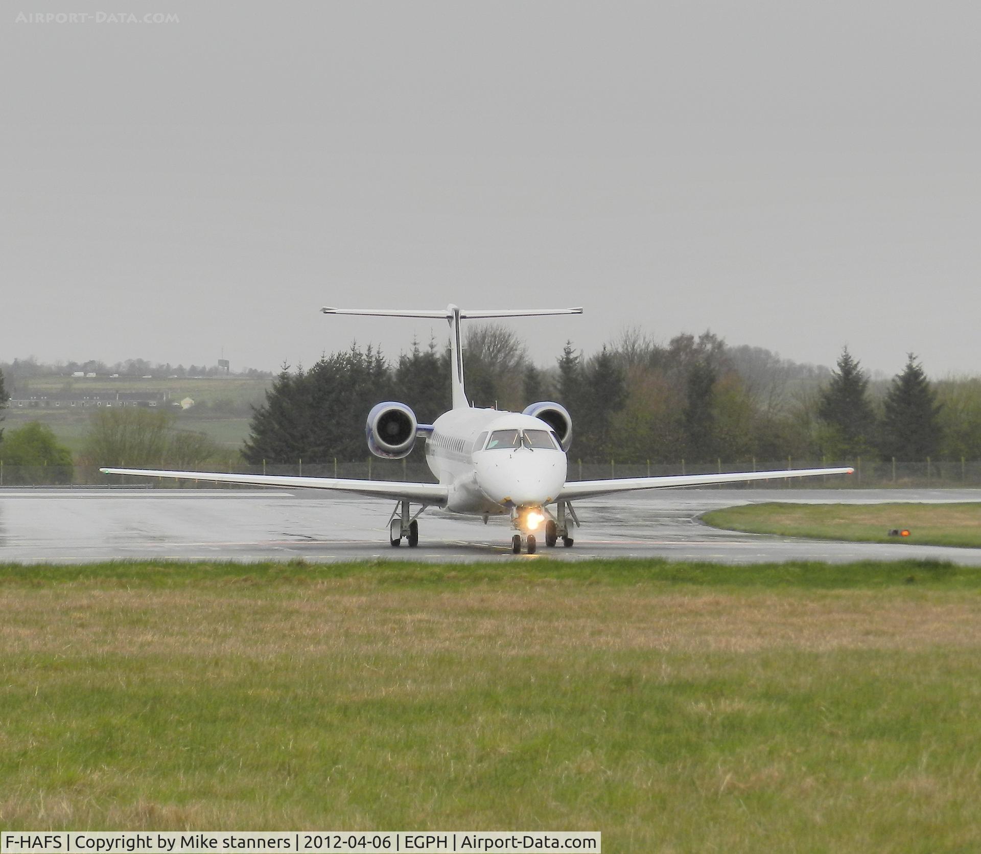 F-HAFS, 1999 Embraer EMB-145EU (ERJ-145EU) C/N 145177, Enhance Aero ERJ-145EU Arrives at EDI In heavy rain on a rugby charter flight