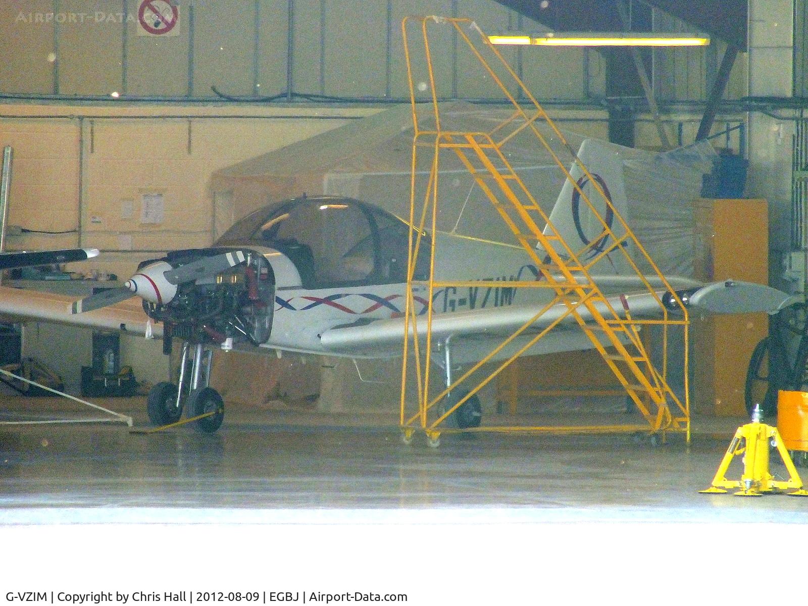 G-VZIM, 2007 Alpha R2160 C/N 160A-07012, at the rear of one of the maintenance hangars