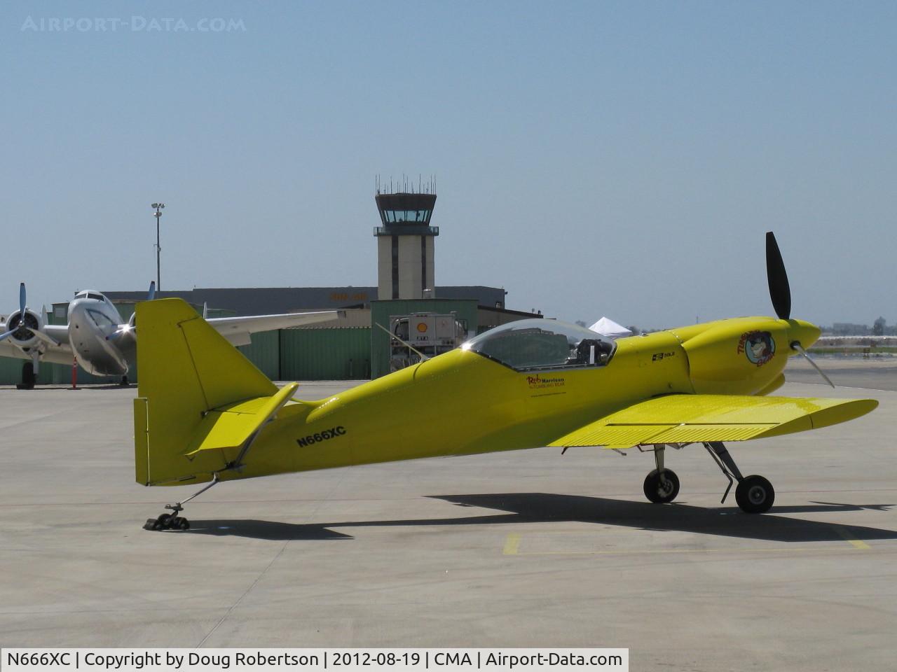 N666XC, 1997 Zlin Z-50LS C/N 0077, 1997 Moravan ZLIN Z50 LS 'Tumbling Bear', Lycoming IO-540 260 Hp, post airshow parking. CMA control tower in background