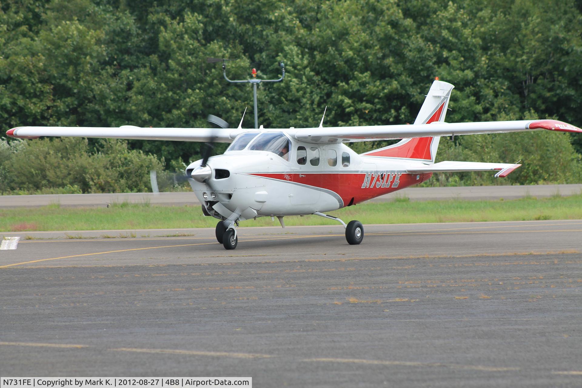 N731FE, 1979 Cessna P210N Pressurised Centurion C/N P210-00450, N731FE taxiing onto the ramp at Robertson.