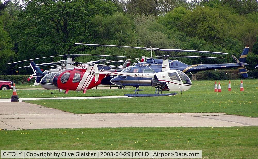 G-TOLY, 1998 Robinson R22 Beta II C/N 2809, Ex: G-NSHR > G-TOLY - Originally owned to, Gnashair Ltd in May 1998 as G-NSHR (acronym). Then owned to, Tolley in February 2001 as G-TOLY (another acronym) and currently with, Helicopter Services Ltd since January 2004.