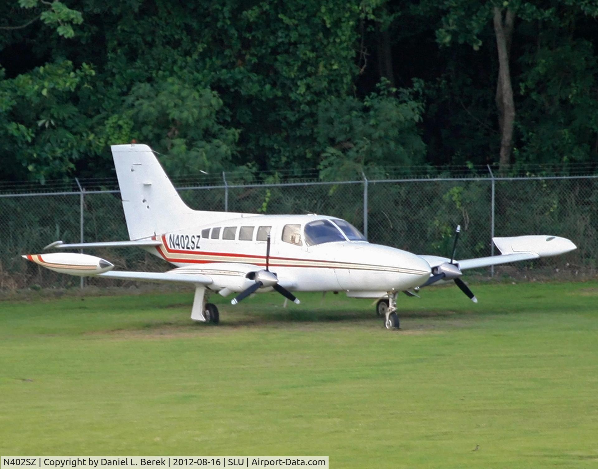 N402SZ, 1975 Cessna 402B C/N 402B0881, This 1975 Cessna 402B belonging to General Aviation Services, has been here since it an unauthorized ferry flight with a damaged landing gear and propeller, resulting in its loss of CoA.