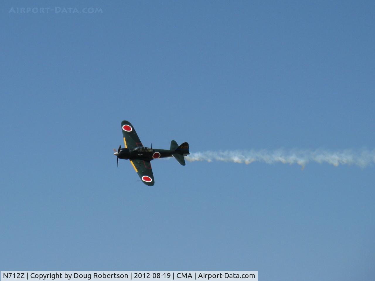 N712Z, 1942 Mitsubishi A6M3 Reisen (Zero) C/N 3869, 1942 Mitsubishi A6M ZERO-SEN (ZEKE), P&W R-1820 Double Wasp 1,130 Hp upgrade from original Nakajima Sakai, overflight Rwy 26 with airshow smoke