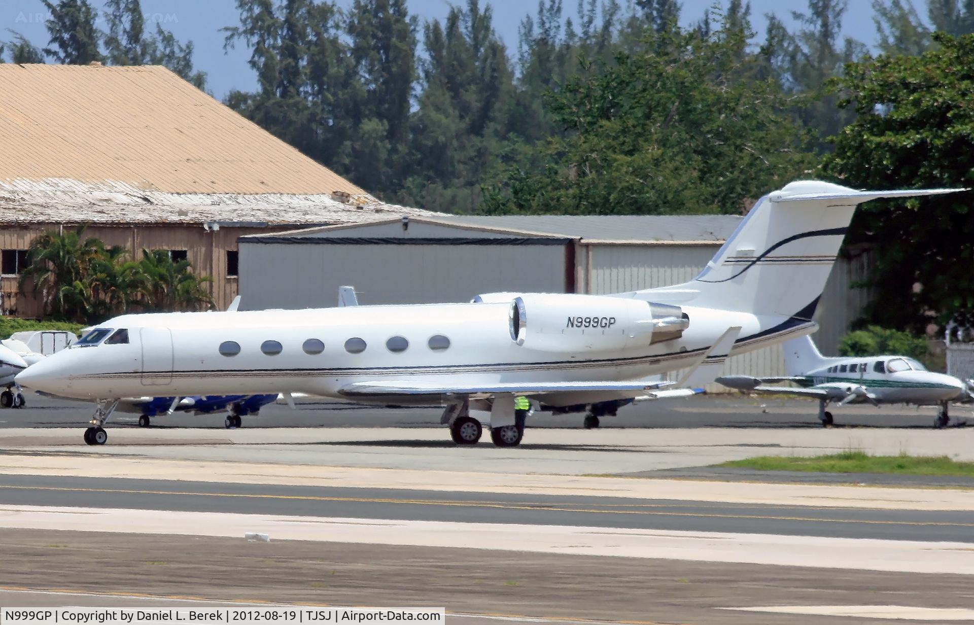 N999GP, 1988 Gulfstream Aerospace G-IV C/N 1061, Passing a gaggle of abandoned DC-3s, Gep Air Triple Niner Golf Papa makes his way toward the general aviation ramp at SJU.