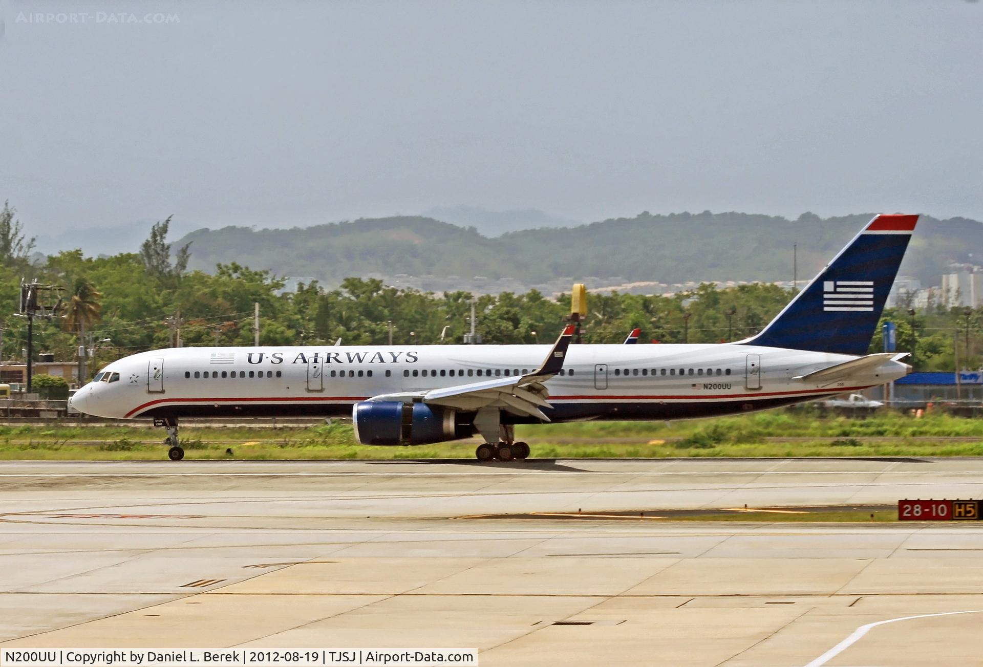 N200UU, 1995 Boeing 757-2B7 C/N 27809, A US Airways Boeing 757, thrust reversers and spoilers deployed, comes to a stop on the southern runway at San Juan.