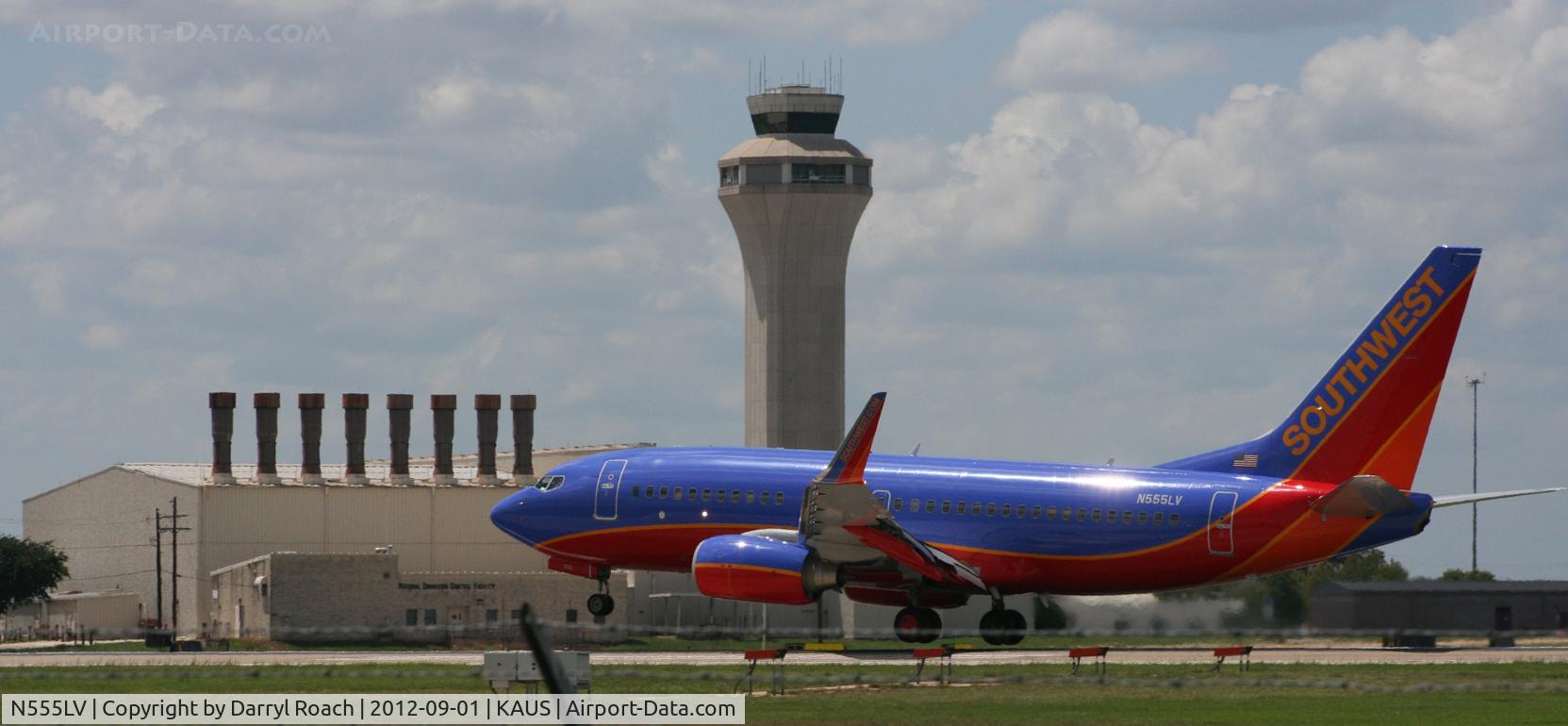 N555LV, 2011 Boeing 737-7BD C/N 36726, The afternoon sun beats down as a SWA B737 lands with the Tower in the background.