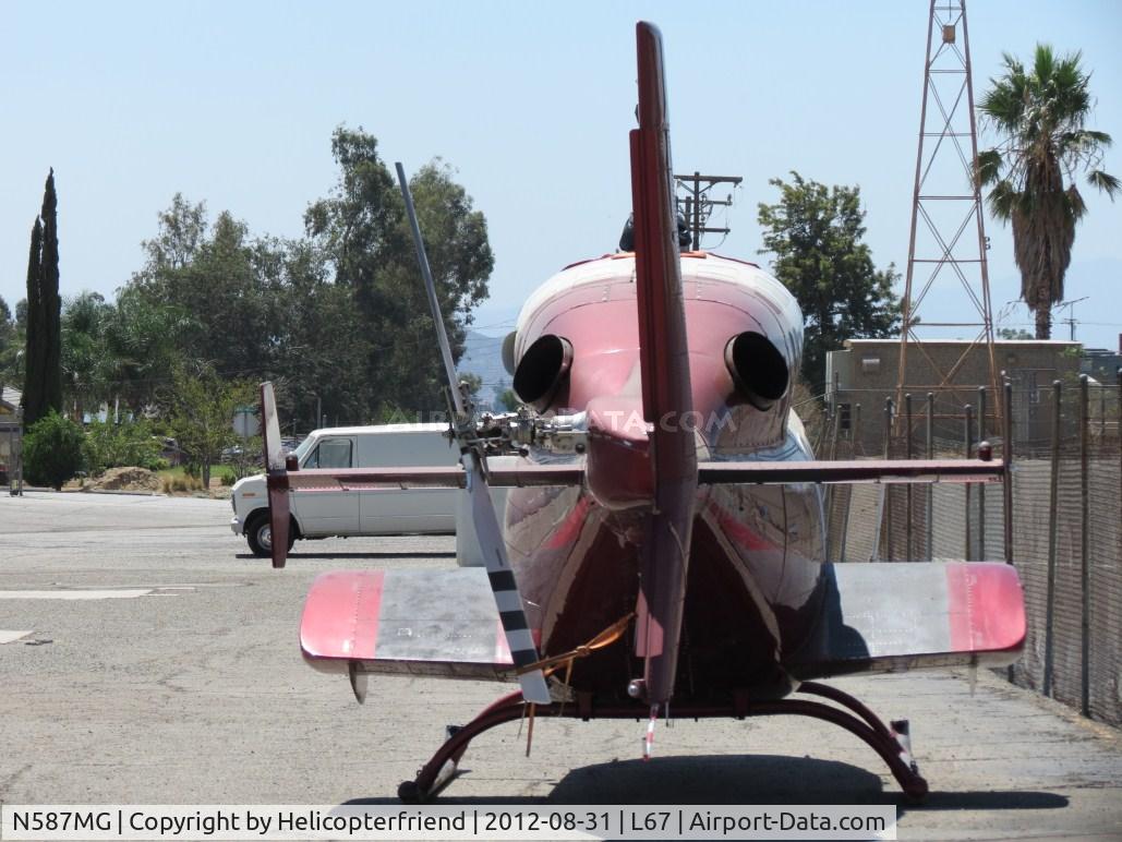 N587MG, 1987 Bell 222U C/N 47566, Parked next to the fence and appears to be out of service at Mercy Air Lot. Main & Tail rotors removed