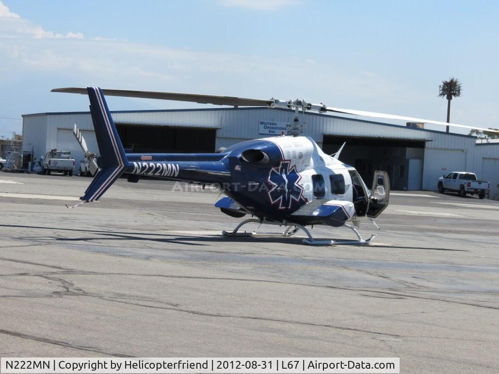 N222MN, 1984 Bell 222U C/N 47534, After completing walk around, entering the ship preparing to start up