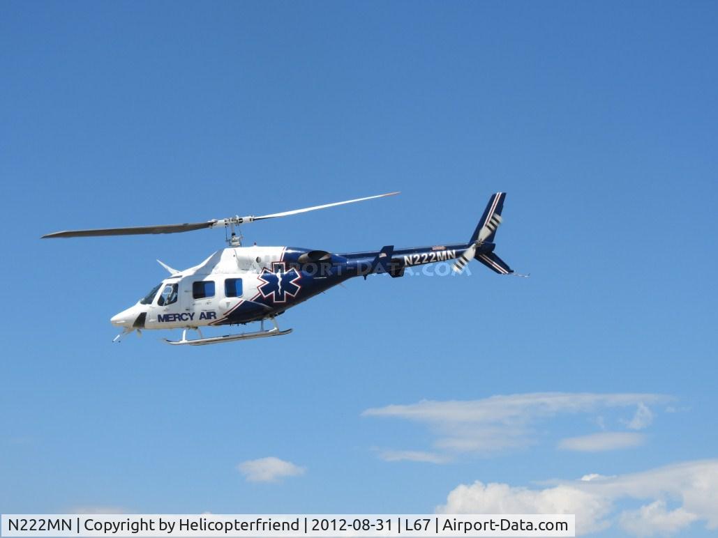 N222MN, 1984 Bell 222U C/N 47534, Heading out westbound before turning back eastbound to head towards station at SBD