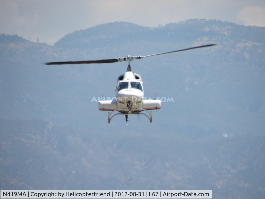 N419MA, 1984 Bell 222UT C/N 47518, On final with a patient, landing at Mercy Air