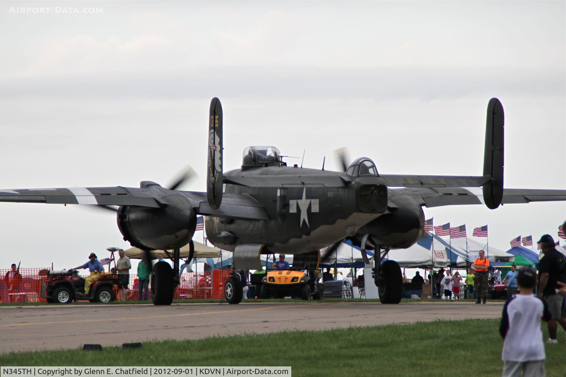 N345TH, 1944 North American TB-25J Mitchell C/N 44-31385A, Taxiing out for flying demonstration.  Quad Cities Air Show.  Overcast and sprinkles.