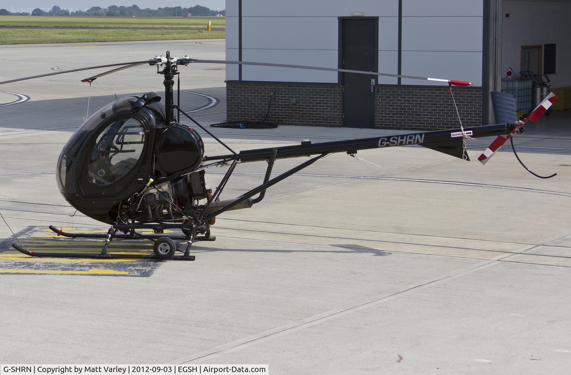 G-SHRN, 2008 Schweizer 269C-1 C/N 0336, Sat on stand at SaxonAir.
