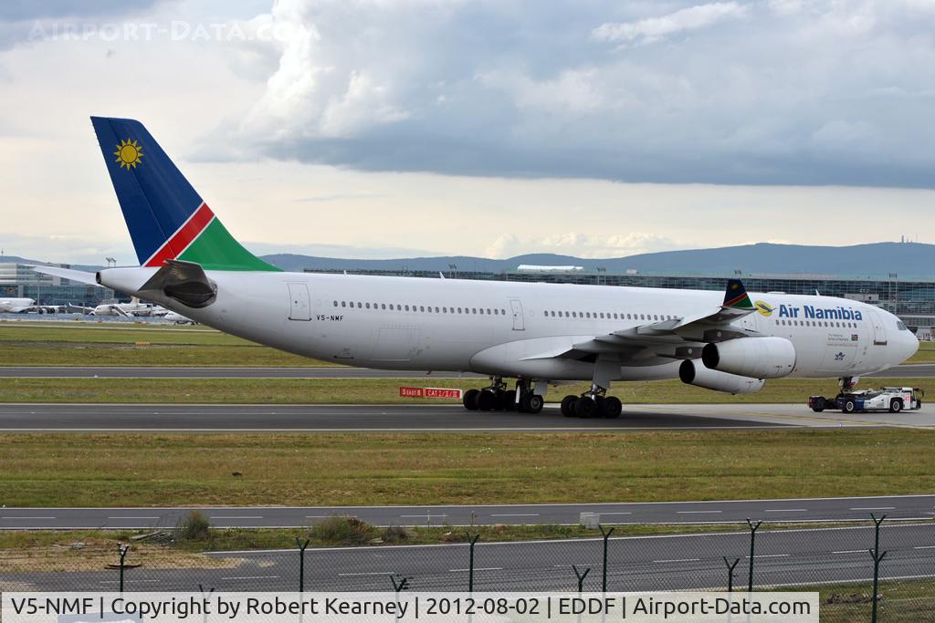 V5-NMF, 1994 Airbus A340-311 C/N 047, Being towed to parking