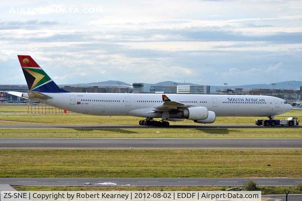 ZS-SNE, 2003 Airbus A340-642 C/N 534, Being towed around to parking