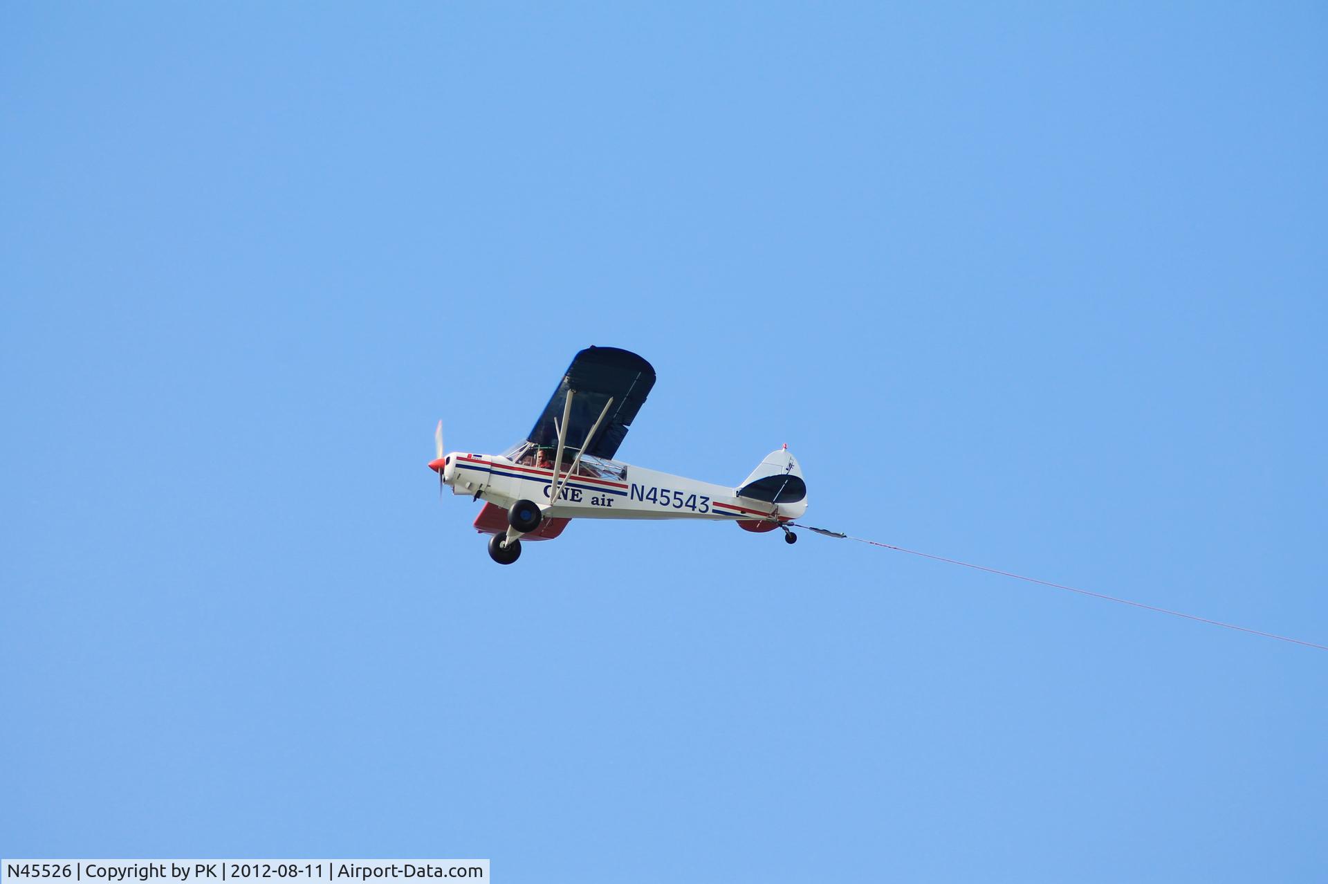 N45526, Piper PA-18-150 Super Cub C/N 18-8109034, Banner towing Piper Super Cup above the beach of Domburg, Zeeland -NL.