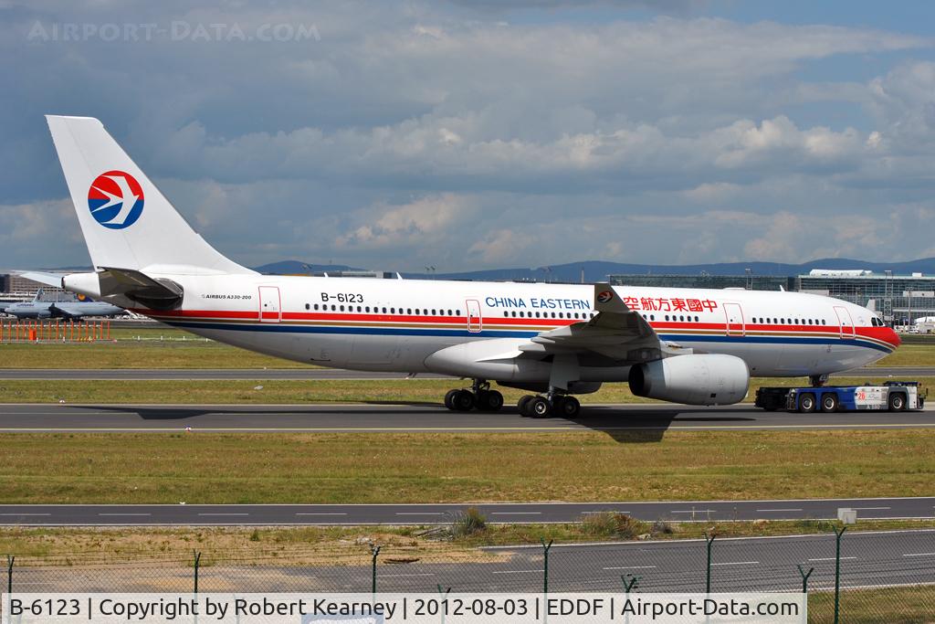 B-6123, 2006 Airbus A330-243 C/N 735, Being towed around to parking