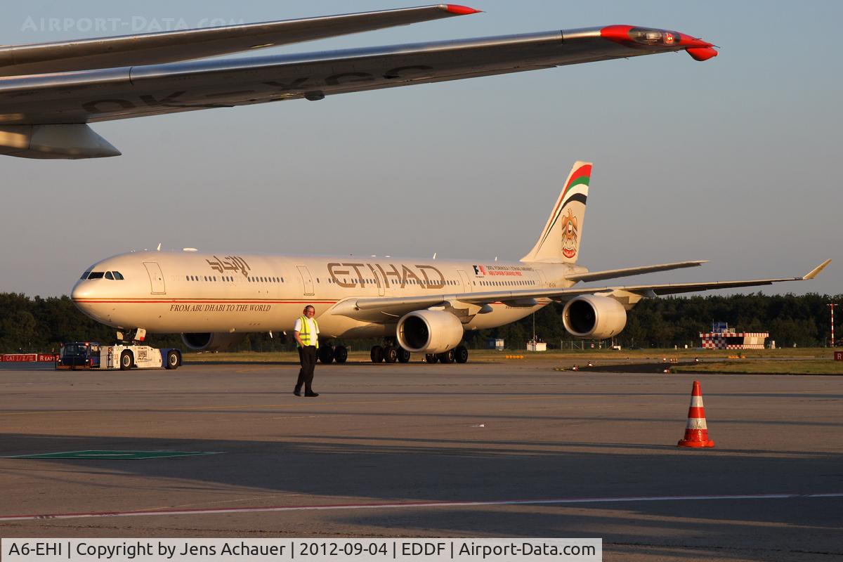 A6-EHI, 2008 Airbus A340-642X C/N 929, Getting towed to the gate