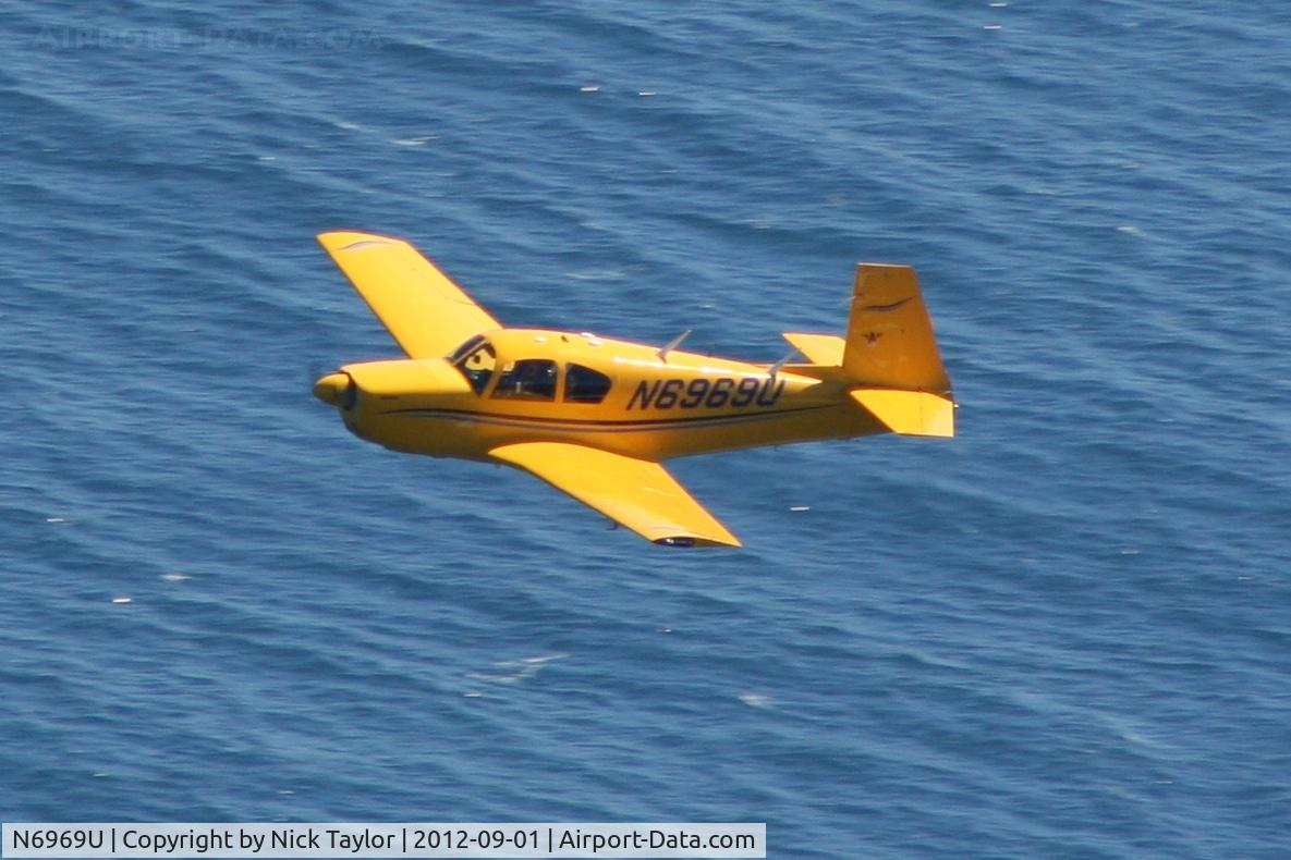 N6969U, 1964 Mooney M20E C/N 329, Passing below along Malibu Beach