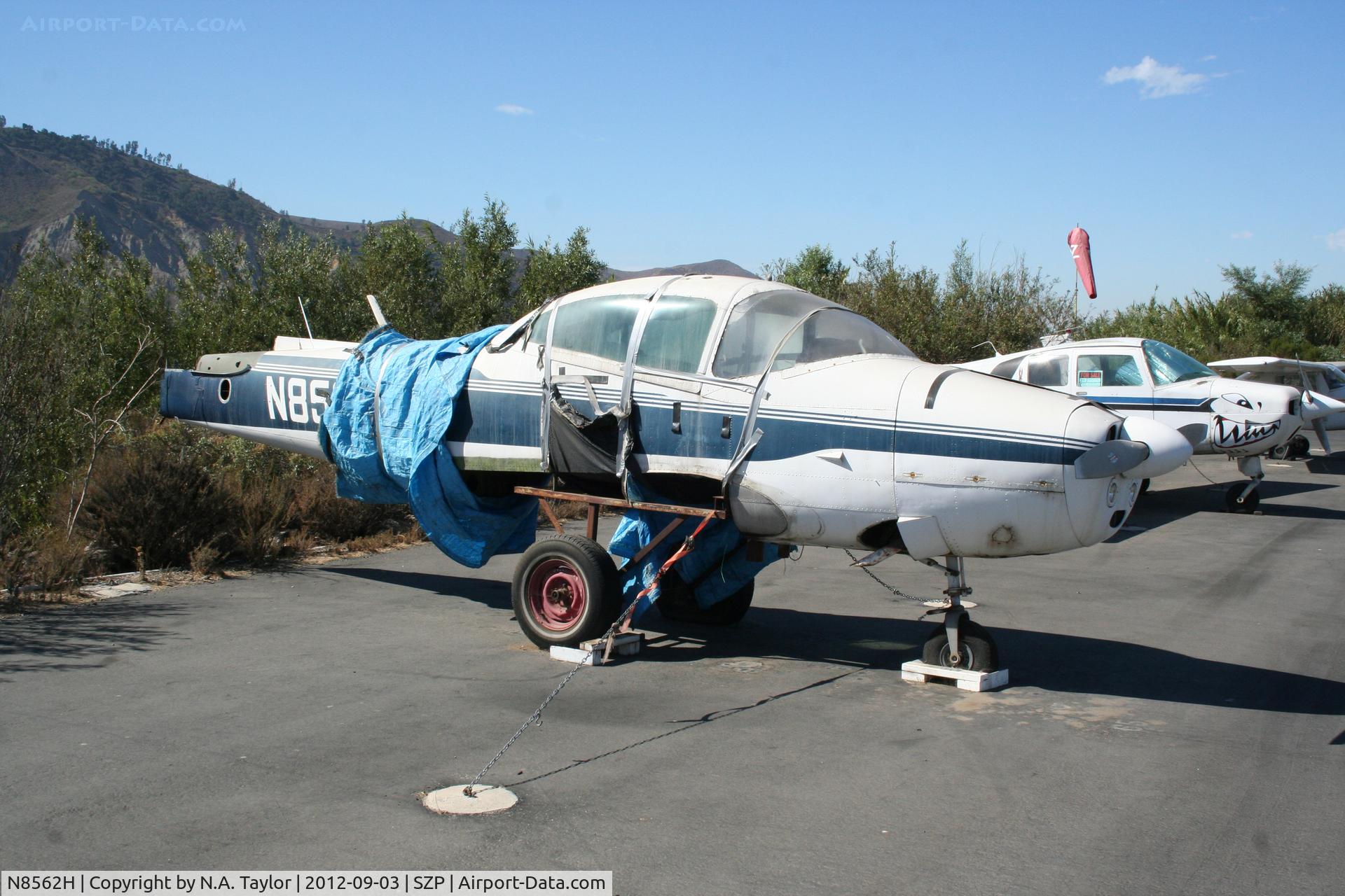 N8562H, 1947 North American Navion (NA-145) C/N NAV-4-614, Parked along the river. Now with tarp