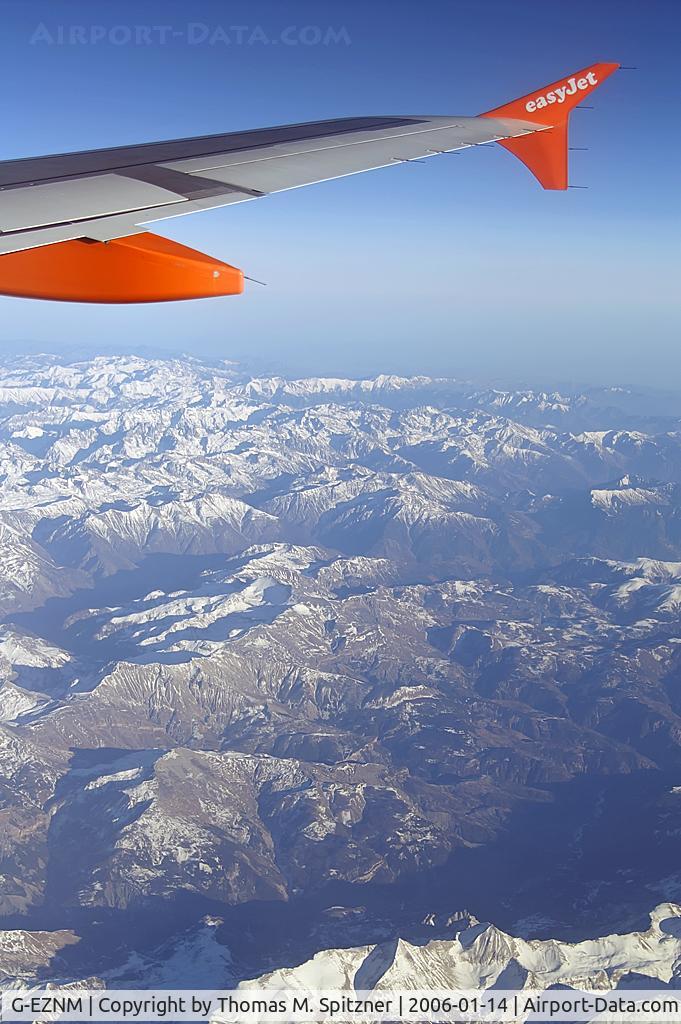 G-EZNM, 2005 Airbus A319-111 C/N 2402, EasyJet Airlines G-EZNM inflight somewhere over the French Alps headed to DTM / EDLW