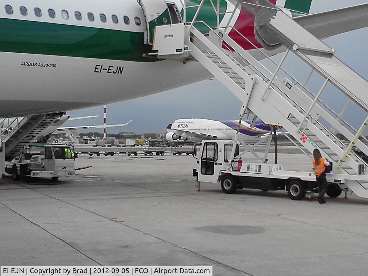 EI-EJN, 2012 Airbus A330-202 C/N 1313, shortly after landing walking to the bus