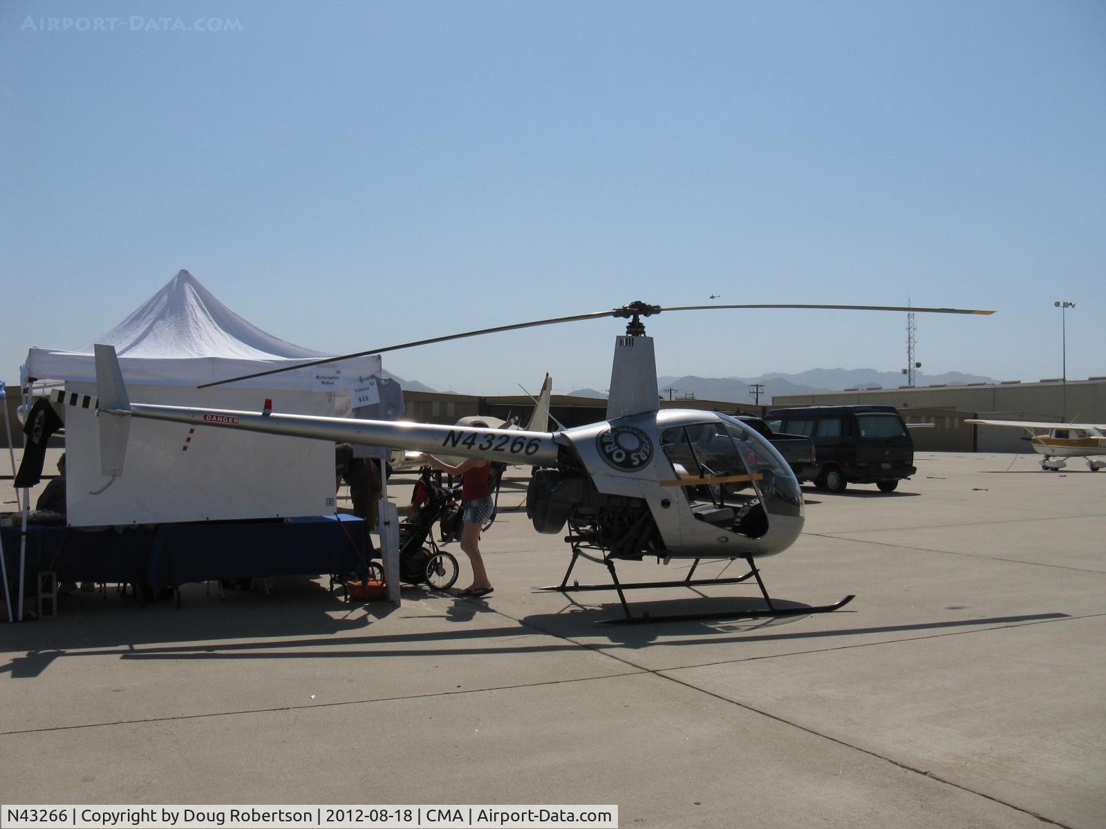 N43266, 1990 Robinson R22 Beta C/N 1268, 1990 Robinson R22 BETA, Lycoming O-320-BC, selling rides in R22, R44 or R66 Turbine of ORBIC Helicopters FBO at CMA  during airshow Wings Over Camarillo 2012.