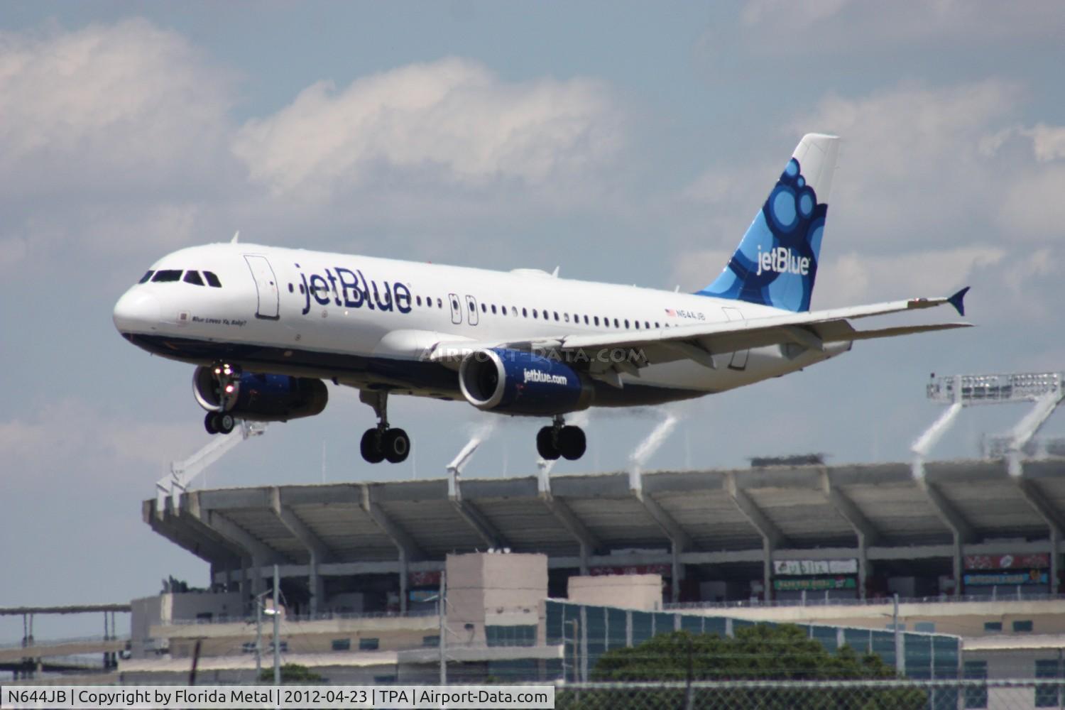 N644JB, 2006 Airbus A320-232 C/N 2880, Jet Blue A320 doing a rare landing on Runway 28 due to high cross winds.  Raymond James Stadium in the background (Tampa Bay Buccaneers NFL football)