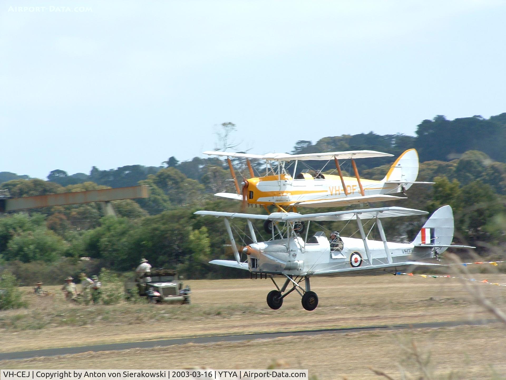 VH-CEJ, 1942 De Havilland Australia DH-82A Tiger Moth C/N DHA1077, VH-CEJ @ YTYA Tyabb 2003 PAC Air Show with VH-DFJ in background