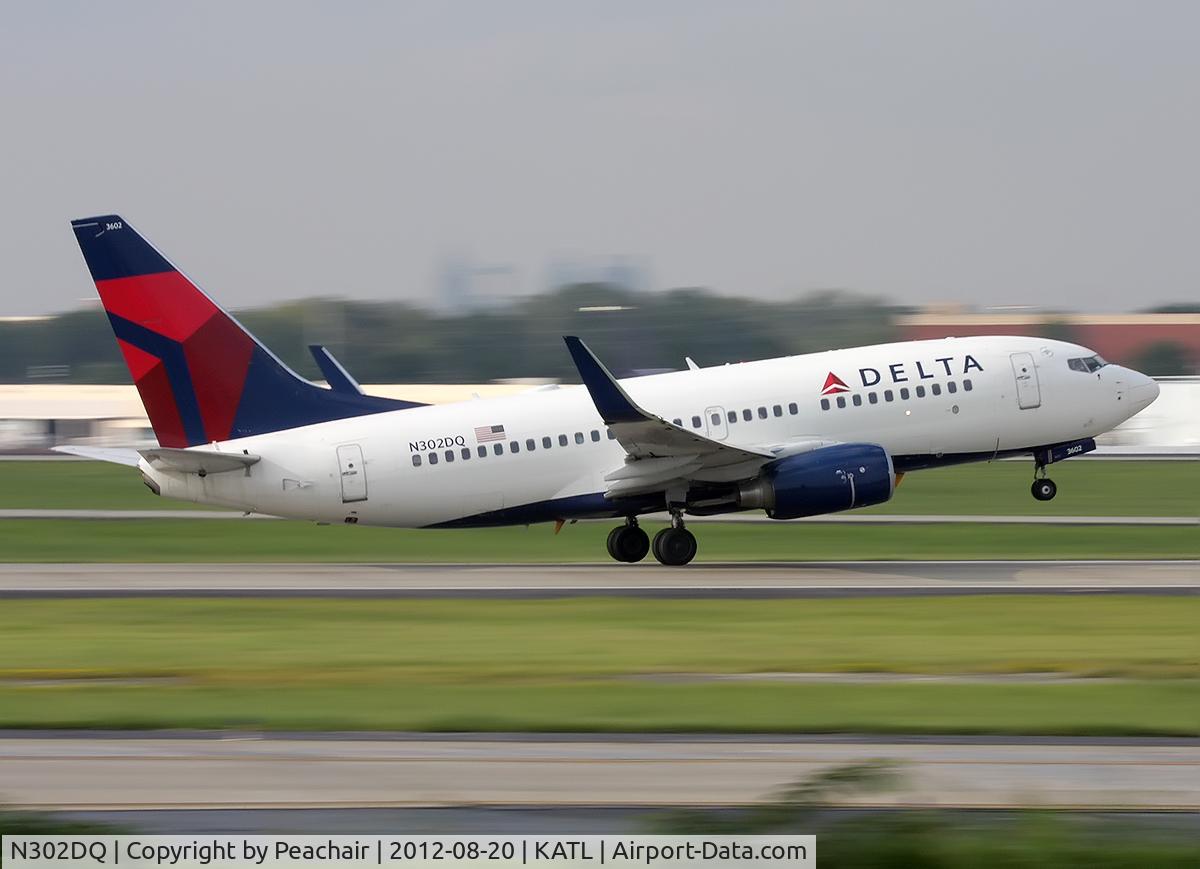 N302DQ, 2008 Boeing 737-732 C/N 29648, 1/60th of a second - West Parking TOC