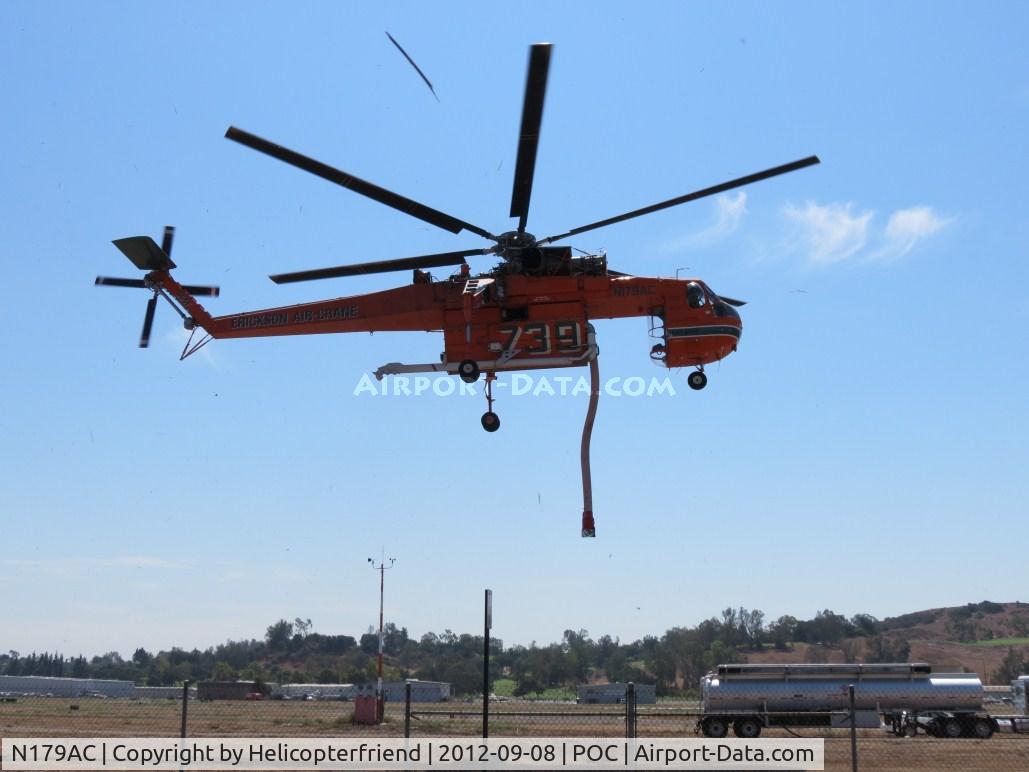 N179AC, 1970 Sikorsky S-64F Skycrane C/N 64091, On lift off, aircraft delivers a 100 mph wind, notice debris airbourne caused by take off thrust of the main rotors