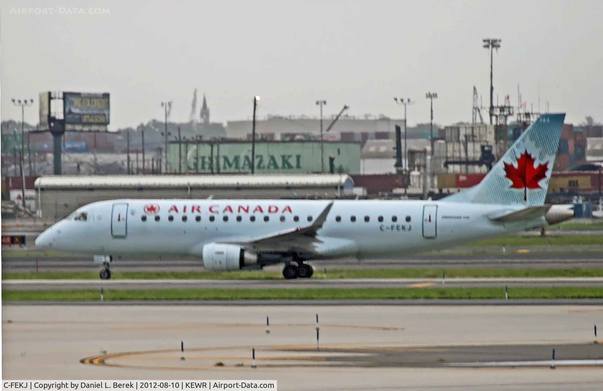 C-FEKJ, 2005 Embraer 175SU (ERJ-170-200SU) C/N 17000109, A Canadian commuter taxies in at a stormy Newark Airport.