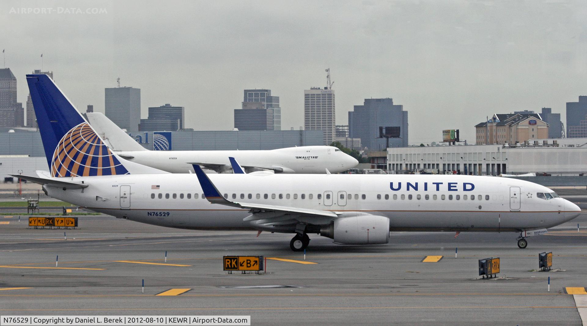 N76529, 2010 Boeing 737-824 C/N 31652, A United 737-800 heads out for the crowded Newark ramp after being delayed by severe local weather.