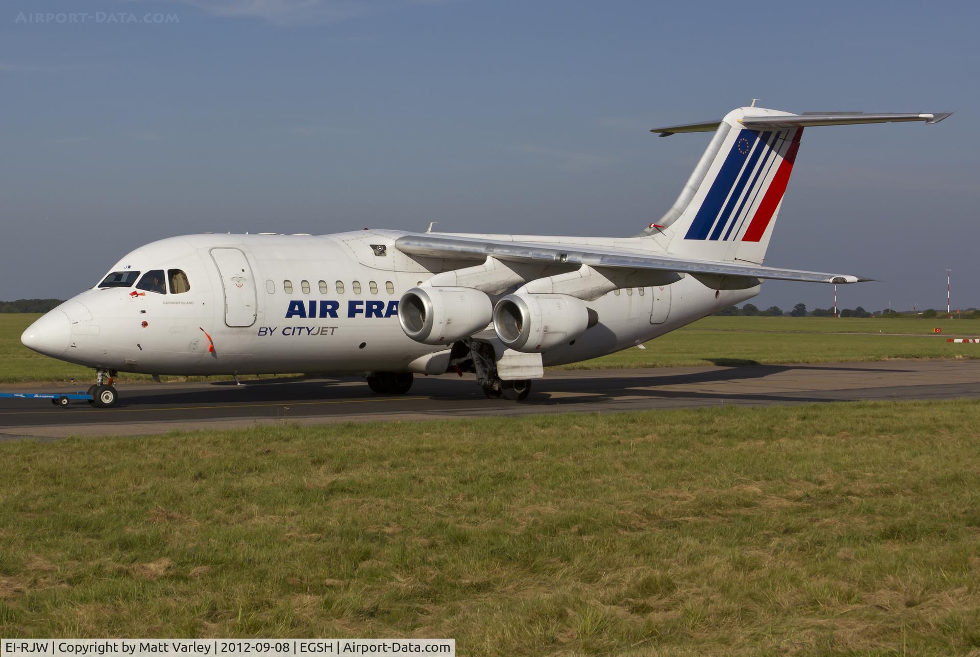 EI-RJW, 2000 British Aerospace Avro 146-RJ85A C/N E2371, Being towed to the North west corner for storage.